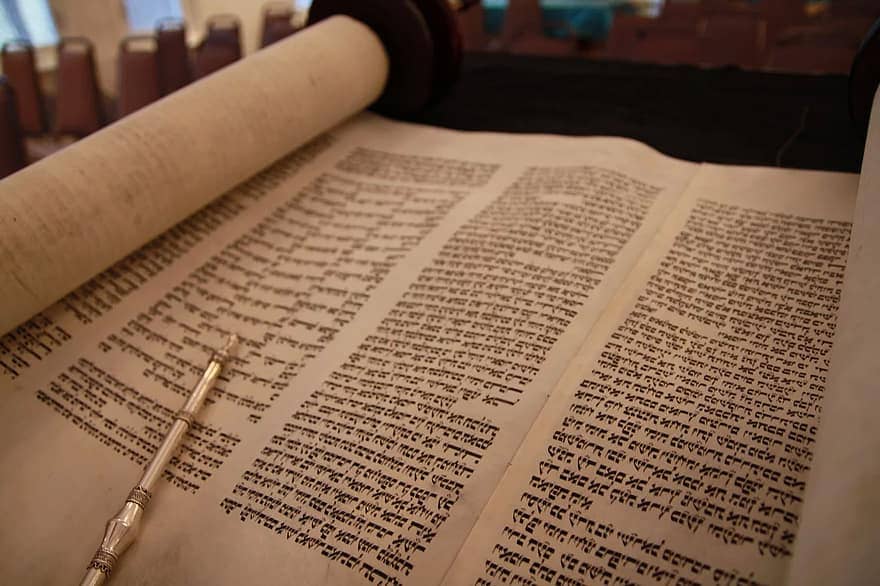 God dictated to Moses the first five books of the bible called the Torah Scrolls